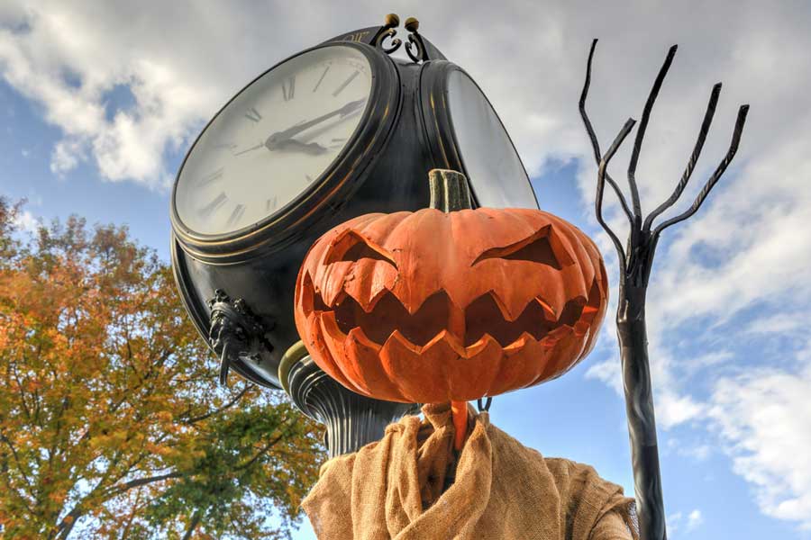 A jack lantern displayed on a town clock